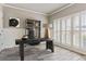 Bright office with hardwood floors, shutters, and a modern desk at 8450 Sundial Ct, Johns Creek, GA 30024