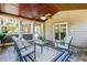 Inviting sunroom with stone flooring, wood ceiling, and comfortable seating, creating a relaxing atmosphere at 8450 Sundial Ct, Johns Creek, GA 30024