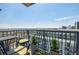 Inviting balcony features stylish seating, potted plants, and panoramic views of the city skyline at 195 14Th Ne St # Ph206, Atlanta, GA 30309