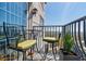 Relaxing balcony with seating, potted plants, and views of the city skyline, perfect for enjoying the outdoors at 195 14Th Ne St # Ph206, Atlanta, GA 30309