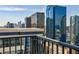 Condo balcony showing views of buildings and the city beyond at 195 14Th Ne St # Ph206, Atlanta, GA 30309