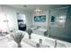 Bright bathroom boasts double sinks, soaking tub, separate shower, and stylish fixtures at 195 14Th Ne St # Ph206, Atlanta, GA 30309