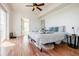 Bright bedroom features hardwood floors, ceiling fan and neutral walls and multiple doorways at 195 14Th Ne St # Ph206, Atlanta, GA 30309