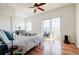 Bright bedroom with hardwood floors, ceiling fan, walkout access and neutral walls at 195 14Th Ne St # Ph206, Atlanta, GA 30309