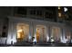 Night view of elegant building exterior featuring white pillars and stairs leading to the entry doors at 195 14Th Ne St # Ph206, Atlanta, GA 30309