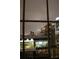 Nighttime city view from the unit highlighting the skyline and building amenities visible from the window at 195 14Th Ne St # Ph206, Atlanta, GA 30309