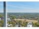 Expansive city view featuring lush green treetops and a clear blue sky at 195 14Th Ne St # Ph206, Atlanta, GA 30309