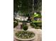 Nighttime courtyard featuring a decorative fountain, manicured greenery, and ambient lighting at 195 14Th Ne St # Ph206, Atlanta, GA 30309
