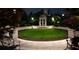 Scenic courtyard featuring a circular lawn, decorative columns, and lush landscaping at 195 14Th Ne St # Ph206, Atlanta, GA 30309