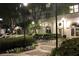 Manicured courtyard at night features mature trees, plantings and ambient street lights at 195 14Th Ne St # Ph206, Atlanta, GA 30309