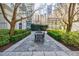 Charming courtyard offers outdoor seating amidst well-maintained landscaping and mature trees at 195 14Th Ne St # Ph206, Atlanta, GA 30309