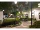 Courtyard at night featuring manicured landscaping, seating areas, and soft lighting at 195 14Th Ne St # Ph206, Atlanta, GA 30309