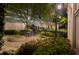 Courtyard area featuring tables, chairs, and beautiful landscaped garden, with lamp posts at 195 14Th Ne St # Ph206, Atlanta, GA 30309