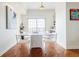 Bright dining area features a white dining table, a modern light fixture, and sliding door access to a balcony at 195 14Th Ne St # Ph206, Atlanta, GA 30309