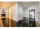 Elegant hallway with sleek marble flooring and decorative mirror accents at 195 14Th Ne St # Ph206, Atlanta, GA 30309
