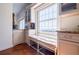 Kitchen nook with built in bench seat, storage, and bright window at 195 14Th Ne St # Ph206, Atlanta, GA 30309