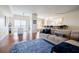 Bright and spacious living room featuring hardwood floors and an open floor plan with kitchen and dining area at 195 14Th Ne St # Ph206, Atlanta, GA 30309