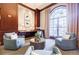 Beautiful lobby with plush chairs, complemented by a large arched window and elegant decor at 195 14Th Ne St # Ph206, Atlanta, GA 30309