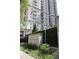 Mayfair signage at building entrance with manicured plants at 195 14Th Ne St # Ph206, Atlanta, GA 30309