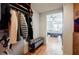 Walk-in closet features custom hanging storage, access to bedroom, and wood floors at 195 14Th Ne St # Ph206, Atlanta, GA 30309
