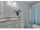 Bathroom with modern vanity, shower, and elegant lighting fixtures at 1674 Executive Park Ne Ln, Atlanta, GA 30329