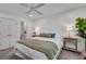 Bright bedroom features a comfortable bed, ceiling fan, and ensuite bathroom at 1674 Executive Park Ne Ln, Atlanta, GA 30329