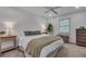 Calm bedroom with neutral walls, a ceiling fan, hardwood floors and soft lighting at 1674 Executive Park Ne Ln, Atlanta, GA 30329