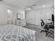 Large bedroom with desk area, ensuite bathroom, closet, and queen bed at 1674 Executive Park Ne Ln, Atlanta, GA 30329