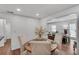 Cozy dining room with wood floors, chair rail, and view into the living room at 1674 Executive Park Ne Ln, Atlanta, GA 30329
