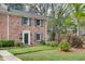 Charming home exterior with green lawn and mature landscaping at 1674 Executive Park Ne Ln, Atlanta, GA 30329