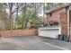 View of the driveway, garage, and back patio of the home at 1674 Executive Park Ne Ln, Atlanta, GA 30329