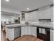 Light and bright kitchen with white cabinets, stainless steel appliances, and breakfast bar at 1674 Executive Park Ne Ln, Atlanta, GA 30329