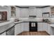 Bright kitchen boasts stainless steel appliances, white cabinets, and sleek countertops at 1674 Executive Park Ne Ln, Atlanta, GA 30329