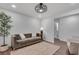 Bright living room with warm lighting, comfortable seating and area rug at 1674 Executive Park Ne Ln, Atlanta, GA 30329