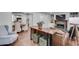 Open living area with hardwood floors boasts a stone fireplace, built-in shelving, leather furniture and neutral paint at 1674 Executive Park Ne Ln, Atlanta, GA 30329