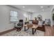 Bright and spacious living room featuring a leather sofa set, an area rug, and plenty of natural light at 1674 Executive Park Ne Ln, Atlanta, GA 30329