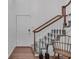 Staircase with neutral gray carpet runner, wooden handrail, and white risers at 1674 Executive Park Ne Ln, Atlanta, GA 30329