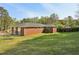 Spacious backyard with a well-maintained lawn and mature trees, perfect for outdoor activities at 2519 Miriam Ln, Decatur, GA 30032