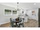 Updated eat-in kitchen featuring white cabinets, granite counters, stainless appliances and backyard views at 2519 Miriam Ln, Decatur, GA 30032
