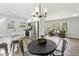 Bright eat-in kitchen with stainless steel appliances, granite counters, and adjacent seating area with backyard views at 2519 Miriam Ln, Decatur, GA 30032