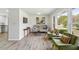 Bright living room with hardwood floors, contemporary furniture, and large windows at 2519 Miriam Ln, Decatur, GA 30032