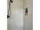Modern walk-in shower with tiled walls and recessed storage niche at 2519 Miriam Ln, Decatur, GA 30032