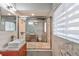 Stylish bathroom with decorative wall tile, vessel sink and glass shower doors at 3348 Lynnray Dr, Atlanta, GA 30340