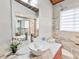 Stylish bathroom featuring a marble vanity, modern sink, and shower at 3348 Lynnray Dr, Atlanta, GA 30340