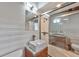 Modern bathroom with decorative tile, floating vanity and glass enclosed shower at 3348 Lynnray Dr, Atlanta, GA 30340