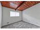 Neutral bedroom with a wooden ceiling and natural light from a window at 3348 Lynnray Dr, Atlanta, GA 30340