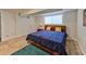 Bedroom with natural light, queen size bed, blue bedding, and neutral tiling and warm wood accents at 3348 Lynnray Dr, Atlanta, GA 30340