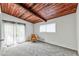 Bright bedroom featuring a wooden ceiling, neutral walls, and carpeted flooring at 3348 Lynnray Dr, Atlanta, GA 30340