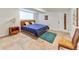 Cozy bedroom with natural light, featuring warm wood accents and a queen size bed with blue bedding at 3348 Lynnray Dr, Atlanta, GA 30340