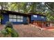 Charming blue two-story home with a modern design, inviting entrance, and carport at 3348 Lynnray Dr, Atlanta, GA 30340